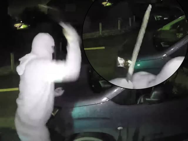 Nathan Smith, 33, has been jailed for 5 years. Here he is smashing the windscreen of a vehicle, while wearing a balaclava, gloves and brandishing a machete.