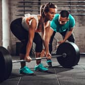 Woman exercising at the gym (Adobe stock)