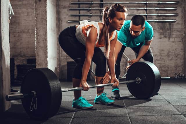 Woman exercising at the gym (Adobe stock)
