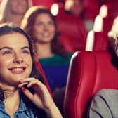 Woman at theatre (Adobe Stock)