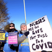 Nurses are continuing to strike in a dispute over pay 