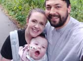 Iris-Rose Torr with her parents Karen and Shane