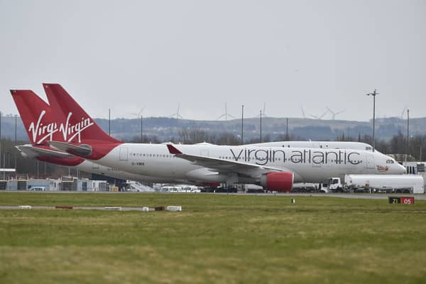 Virgin Atlantic planes sit on the runway at Glasgow Airport.