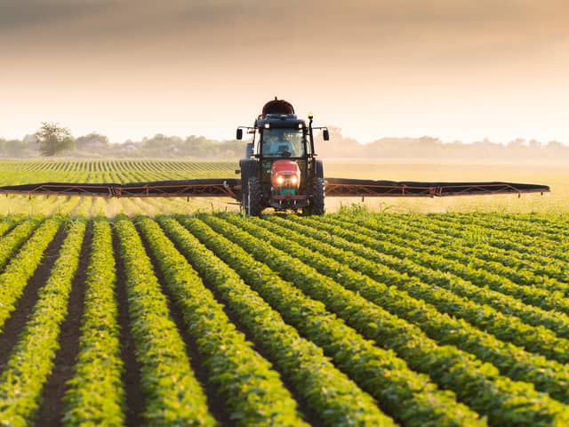 A toddler died after being hit by a tractor in Devon