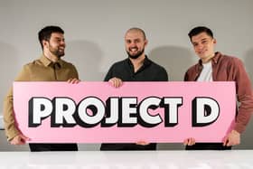Project D's founders are all smiles