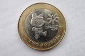 The £2 coin features the official mascot of the games, Tosha the Cat, as well as the logo of the games.