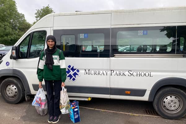 A Murray Park student delivering food parcels in Derby