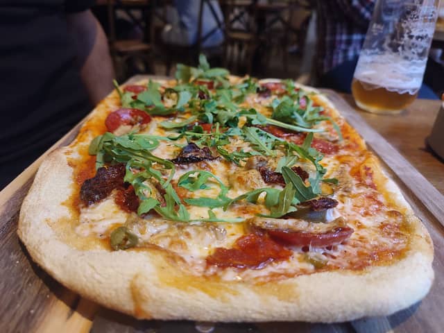 One of the meal deals on our list is this spicy sausage Diavola pizza at Harpur's of Melbourne where you can get two pizzas for £14.99 | Image Ria Ghei