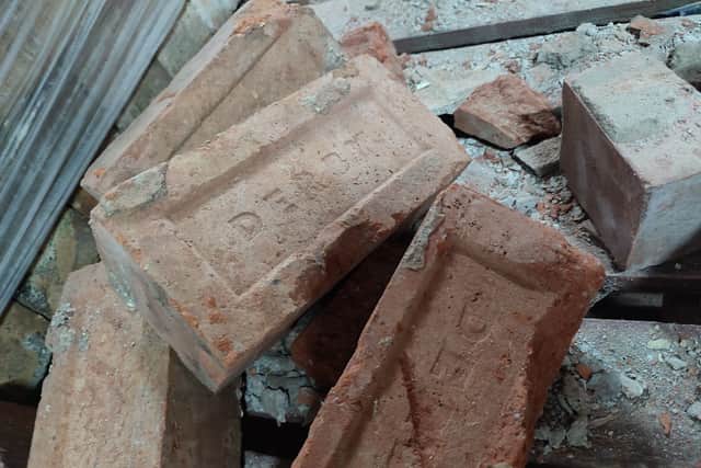 Bricks emblazoned with ‘Derby’ at the live construction site of Derby Market Hall