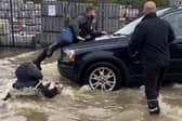 A motorist collided with a man and knocked a woman over during Storm Babet