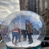 Make fun memories with loved ones by climbing into a giant snowglobe in Derby and striking a variety of awesome poses