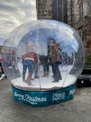 Make fun memories with loved ones by climbing into a giant snowglobe in Derby and striking a variety of awesome poses