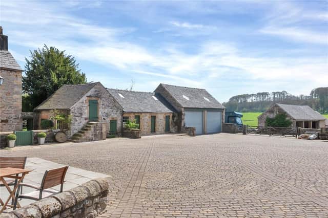 The farmhouse boasts numerous outbuildings