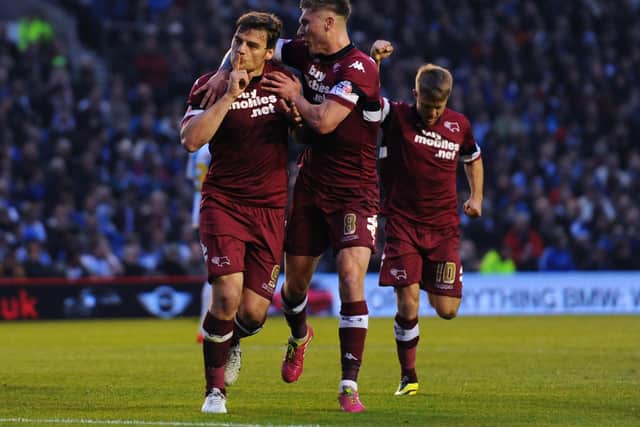 Chris Martin celebrates scoring in the 2013/14 Championship playoff semi-final against Brighton and Hove Albion