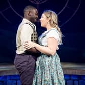 Jason Yeboa as Micah and Áine O’Neill-Mason as
Cinderella embrace on stage at Derby Theatre | Image Graeme Braidwood