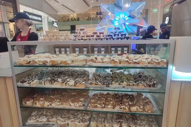 It took all my will power not to clamber over the packed counter and start eating the stunning range of cinnamon buns | Image Ria Ghei