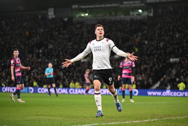 James Collins celebrates scoring for Derby County in a League One match vs Lincoln City