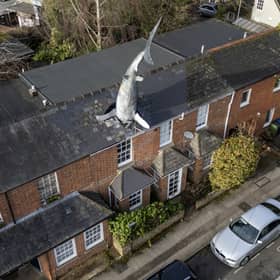 The owner of a world-famous house with a 25ft shark sticking out of the roof has been banned from renting it out on Airbnb Picture: Tom Wren / SWNS