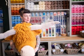 Talented knitter and crochet artist Sherri O’Shaughnessy is pictured with one of her amazing creations, a Highland cow | Image I C Things Photography