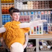 Talented knitter and crochet artist Sherri O’Shaughnessy is pictured with one of her amazing creations, a Highland cow | Image I C Things Photography