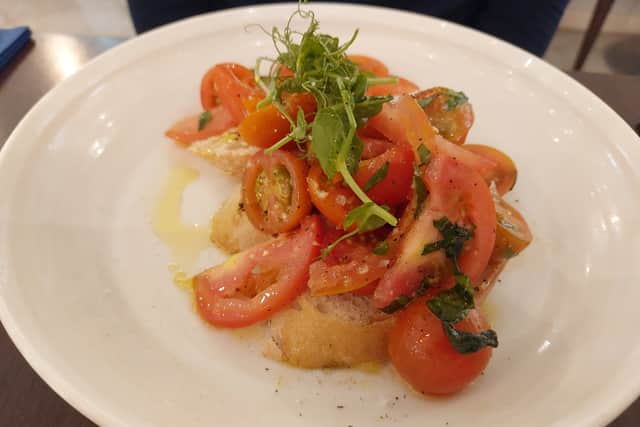 Fresh and juicy tomatoes piled high on crisp bread was a joy to look at, and to eat | Image Ria Ghei