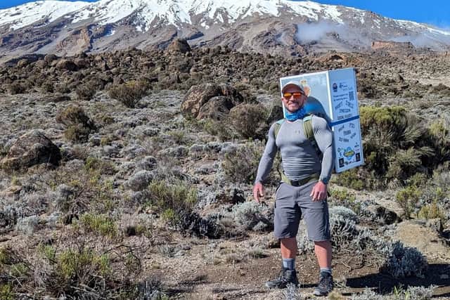 Michael Copeland from Stafford, on his climb up Kilimanjaro with a fridge on his back. Mr Copeland became a bodybuilder when he left the Army, and said he had been taking on physical challenges since the age of 15 as a way of dealing with his own mental health challenges.