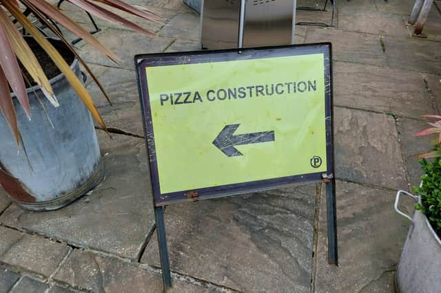 Pizza Construction sign near the entrance raises a smile | Image Ria Ghei