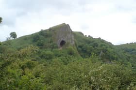 Thor's Cave is hidden in the Manifold Valley in the Derbyshire Peak District 
