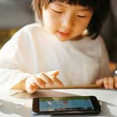 Children being handed loud mobile phones or tablets can be a real headache for the rest of us