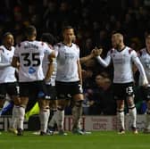 Joe Ward, second right, is congratulated after giving Derby the lead at Fratton Park last Tuesday night