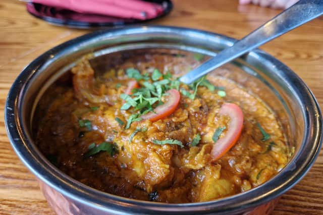 Chicken Bhuna served with a garnish of sliced tomato was a hit at the table Photo Ria Ghei