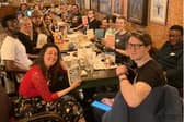 Silent Book Club Derby is a reading club and social group that is taking the city of Derby by storm. Pictured is the group from a meeting in May 2024