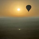 Journalist Nicola Adam journeys across the Dubai desert at dawn by hot air balloon

