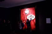 Protesters pasting over the royal portrait (Photo: Animal Rising/Supplied)
