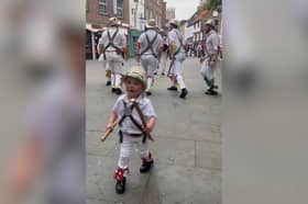 Two-year-old Toby dances along with father’s Morris dance group.