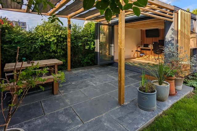 Next to the office, Graham and Sarah have built a shaded patio area with a bench for social functions.