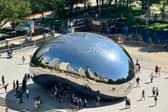 Chicago cityscape reflected in iconic Cloud Gate monument, known as 'The Bean'