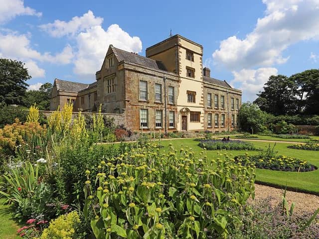 Canons Ashby is a striking Tudor manor overlooking pretty terraced gardens