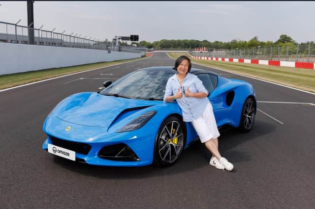 The gran with a newly acquired taste for supercars poses with her brand-new Lotus. Its features include a KEF 560W audio system, heated, 12-way adjustable seats and automatic LED headlights.