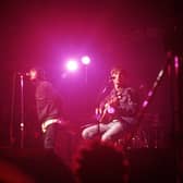 Liam Gallagher and Noel Gallagher of Oasis perform on stage at The Electric Ballroom, Camden on May 9 1996 (Photo by Getty Images) 