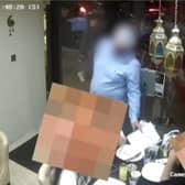 Man allegedly distracts diners before ‘swiping phone’.