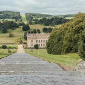 Travel experts have named Chatsworth House as one of the most iconic landmarks in Derbyshire. It garnered over 3.1 million Wikipedia searches. Pictured is a view of Chatsworth House from the Cascade