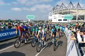Stage 4: Derby to Newark-On-Trent, - race start at Pride Park, Callum Thornley, Paul Magnier (Soudal Quick-Step), Stevie Williams (Israel - Premier Tech), Oscar Onley