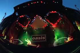 British rock group, Oasis, performing at Knebworth House, Hertfordshire, 10th August 1996. (Photo by Brian Rasic/Hulton Archive/Getty Images)