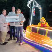 Three Derbyshire boatmakers presented a £500 donation to Susan Veitch from Invergordon Lifeboat Station. Pictured L>R Susan Veitch, Richard Wood, Christine Dence, Pete Hartshorn (piloting the boat)