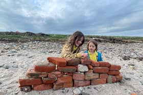 Heidi and Thea on the beach on Holy Island. Meet the family who live on an island that can only be accessed twice a day and only has five children in the local school. 