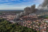 Aerial images show fire fighters tackling flames of a huge fire in Manchester 