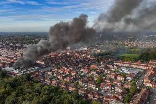 Aerial images show fire fighters tackling flames of a huge fire in Manchester 