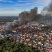 Aerial images show fire fighters tackling flames of a huge fire in Manchester 