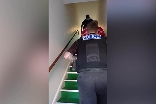 Video grab from the police's visit to the retirement housing estate on Deepway Lane, Exminster.